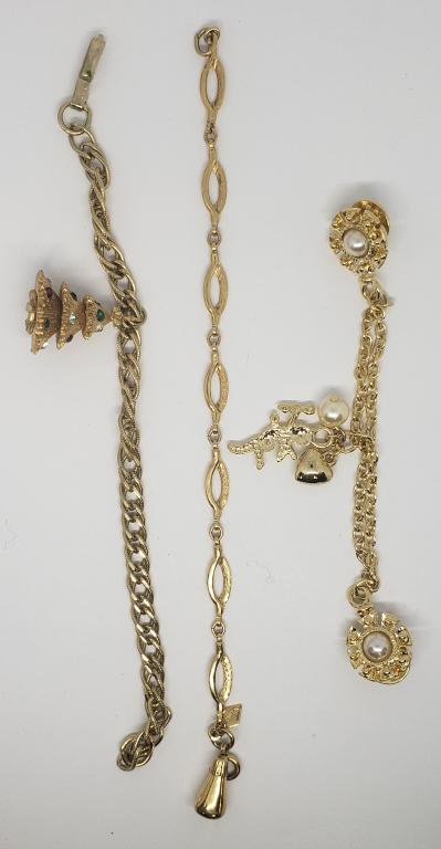 2-VINTAGE GOLD TONED CHARM BRACELETS: (1)WITH RHINESTONE CHRISTMAS TREE & (1)GOLD TONE COLLAR PIN WITH ANGEL CHARM