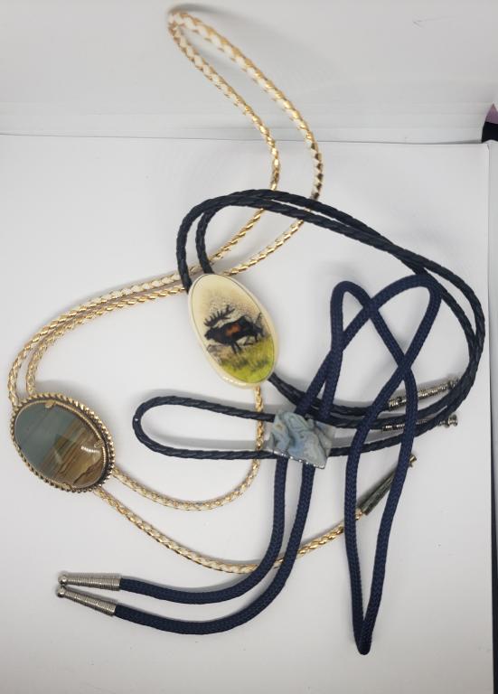 3-SOUTHWESTERN BOLO TIES WITH PENDANTS: (2)POLISHED NATURAL STOE (1)MOOSE SCENE-(2)LEATHER (1)NAVY ROPE