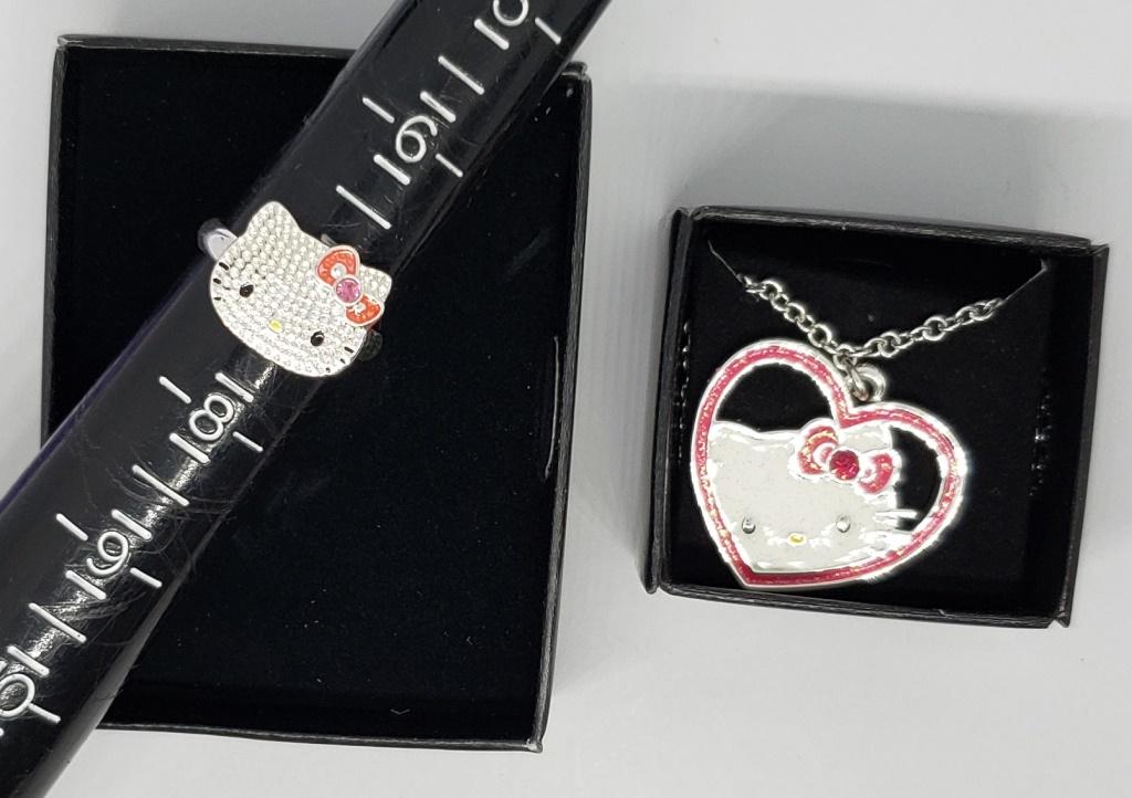 1-VINTAGE HELLO KITTY NECKLACE PLUSE RING: PINK ENAMEL AND RHINESTONES