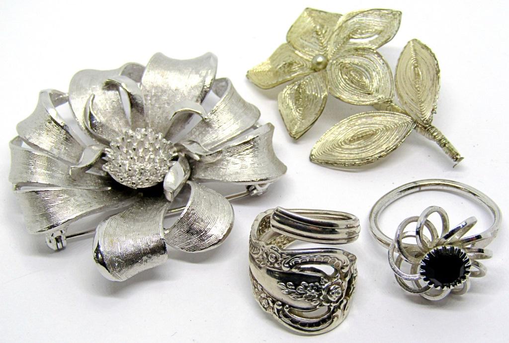 2 VINTAGE BROOCHES & 2 RINGS;: ALL ARE SILVER TONED! 1 BROOCH IS MARKED CORO!
