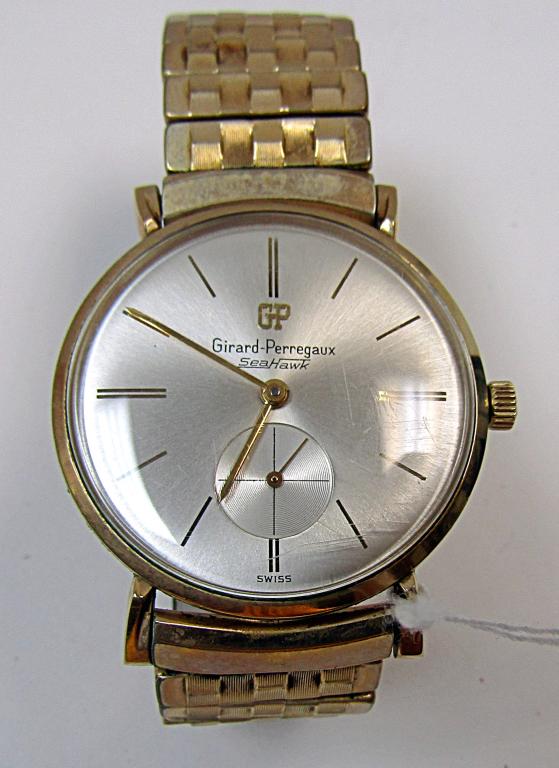 GENTS GIRARD PERREGAUX GOLD FILLED: MANUAL WIND DRESS WATCH w/GOLD FILLED STRETCH BAND. RUNNING- BACK w/ENGRAVED CORP. AWARD DATED 1962