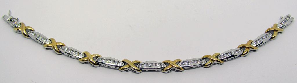 7.5 INCH STERLING TENNIS BRACELET WITH CZ: GOLD TONED "X" ACCENTS-TOTAL 10.8 DWT