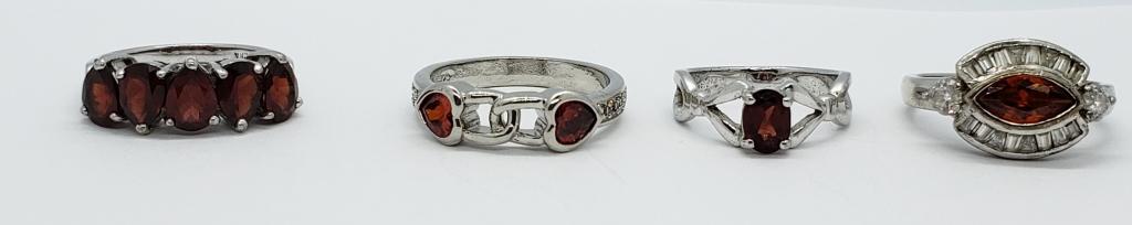4-GORGEOUS STERLING RINGS WITH GARNET ACCENTS: SHOW STOPPERS!!! VARIOUS SIZES 6-10. TOTAL 10.5 DWT
