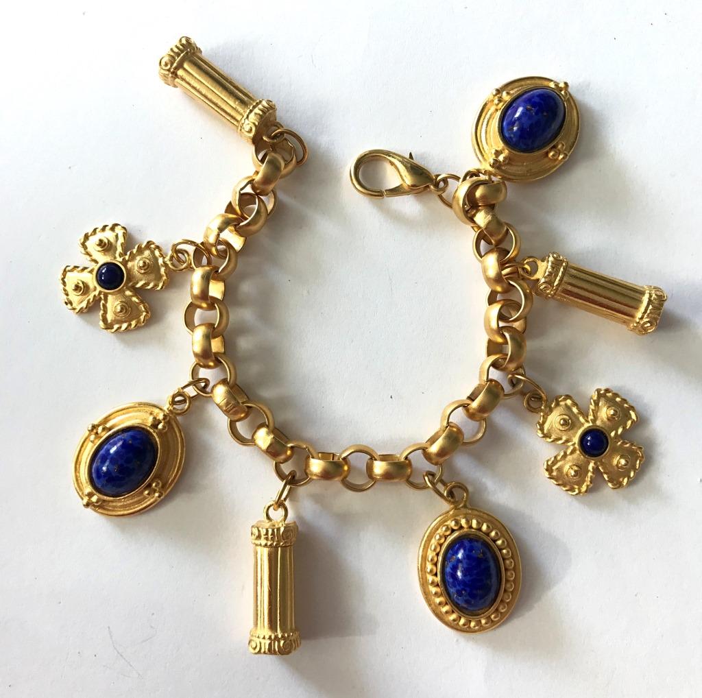 CHARM BRACELET W/ BLUE STONES GOLD TONE: BID NOW!