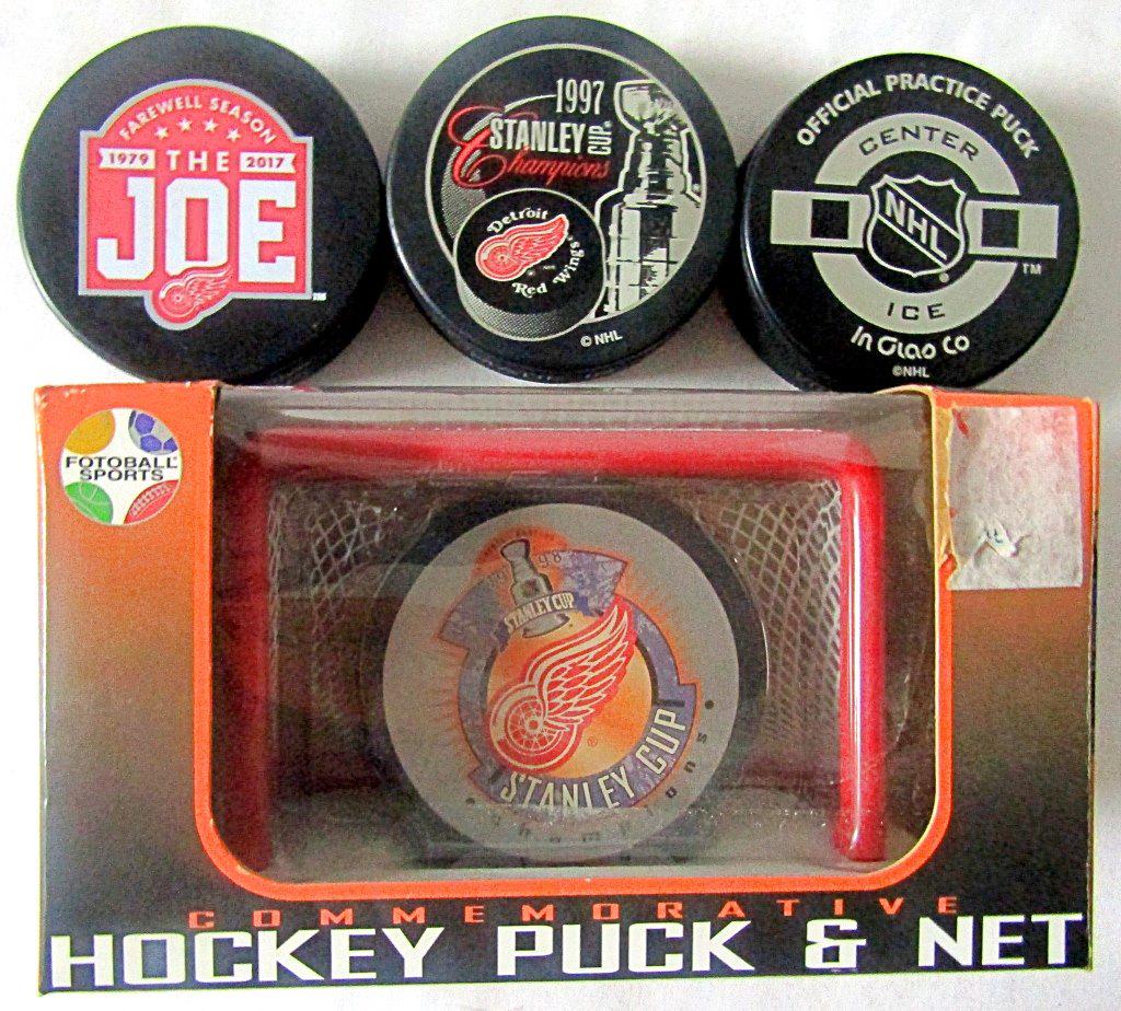 (4) COMMEMORATIVE HOCKEY PUCKS (1 of 2)