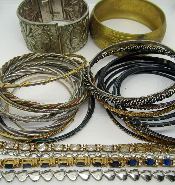 31 MULTI TONED BRACELETS: THREE MARKED AVON