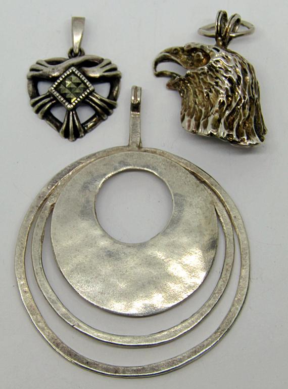 3-STERLING PENDANTS: (1)BALD EAGLE (1)HEART: MARCASITE (1)CUT OUT CIRCULAR DESIGN-TOTAL 11.2 DWT