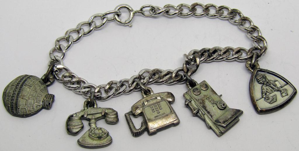 Sterling Charm bracelet with Telephone Charms: DWT 14.6