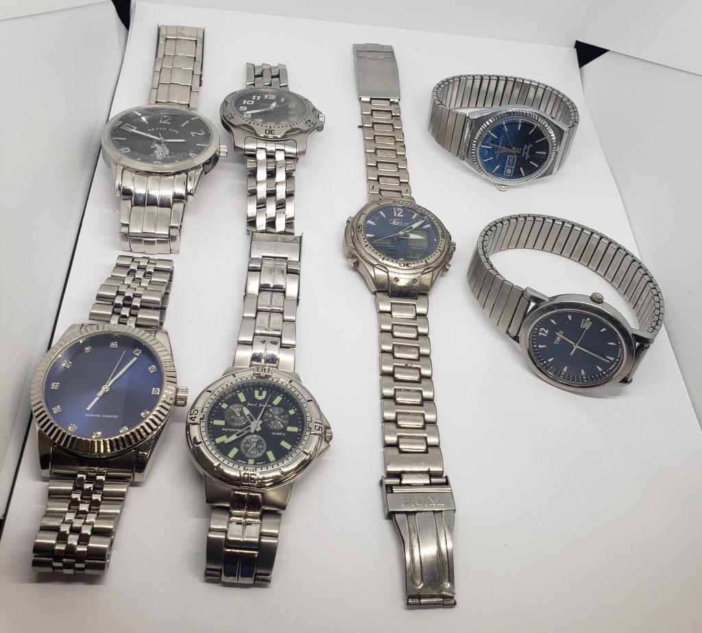 7-MEN'S SILVER TONED FASHION WRISTWATCHES:: (1)BUM ALARM (1)GENUINE DIAMOND (1)REMINGTON ELECTRA DAY DATE (1)PAUL JORDIN (1)TIMEX DAY DATE (1)US POLO-ALL WATCHEST UNTESTED-PARTS/REPAIR