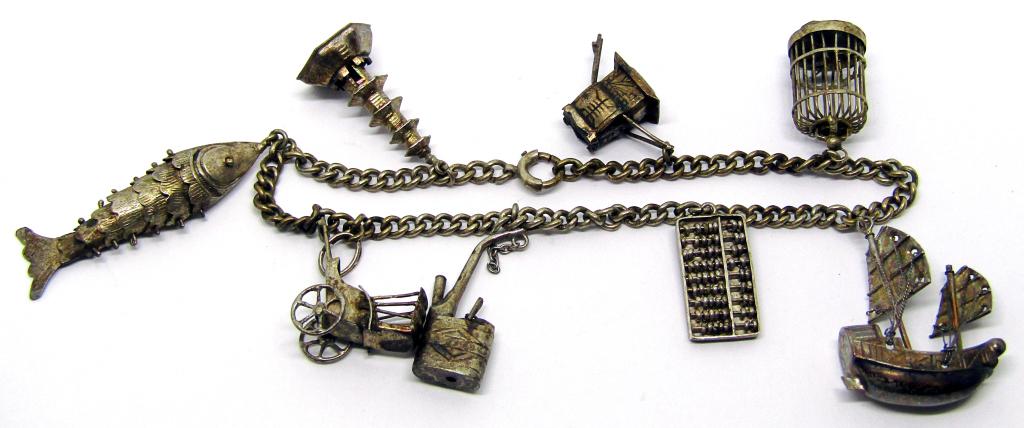 VINTAGE SOUTHWESTERN CHARM BRACELET: (8)CHARMS-TOTAL 8.7 DWT