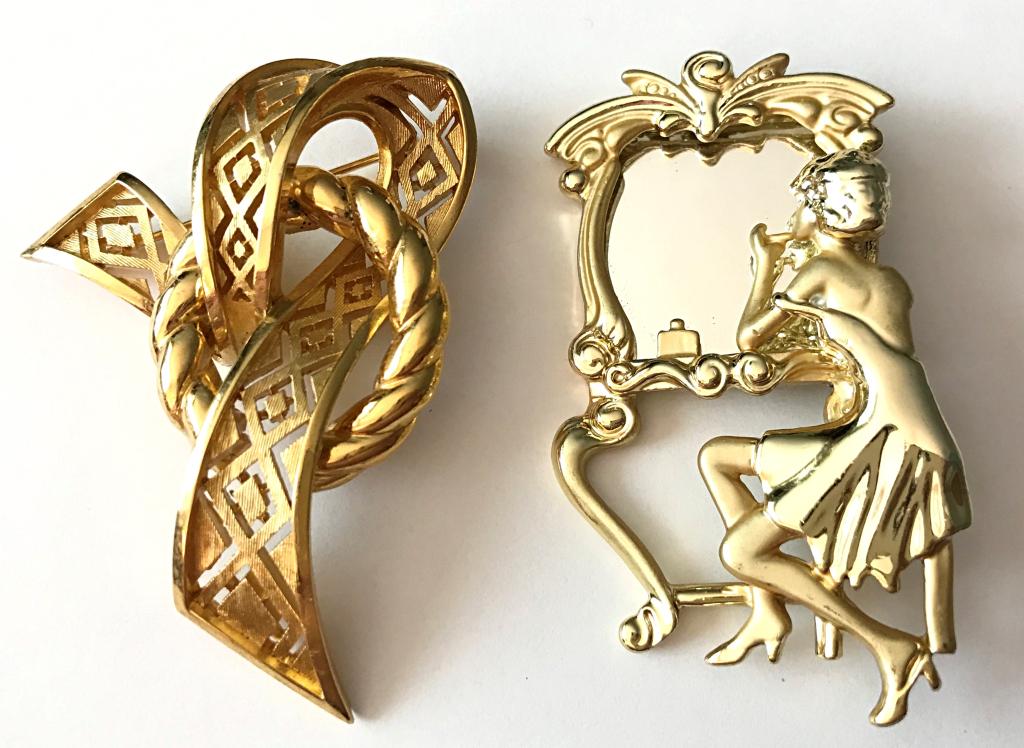 2 VINTAGE BROOCHES GOLD TONE- MUST SEE: BROOCH 1-RIBBON/CIRCLE MARKED TRIFARI, BROOCH 2- WOMAN APPLYING MAKE UP IN THE MIRRIOR- VERY DETAILED AND PRETTY!!