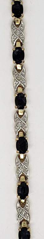 STERLING GOLD TONED TENNIS BRACELET WITH: NAVY BLUE AND CLEAR STONE ACCENTS-TOTAL 7 DWT