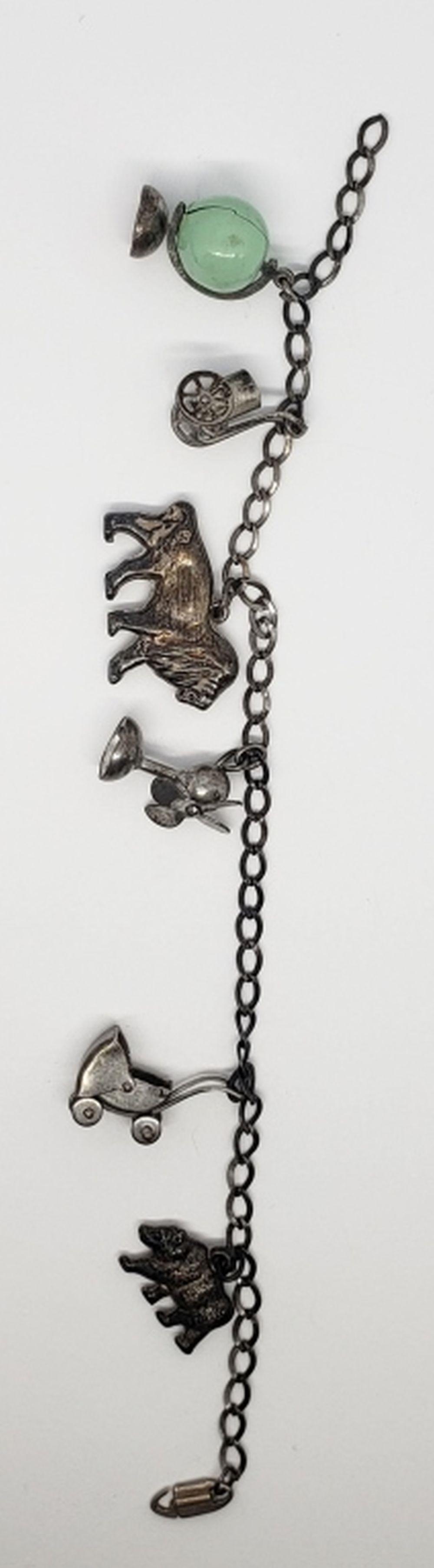 6.5 INCH VINTAGE STERLING CHARM BRACELET WITH: (6)CHARMS-TOTAL 9 DWT