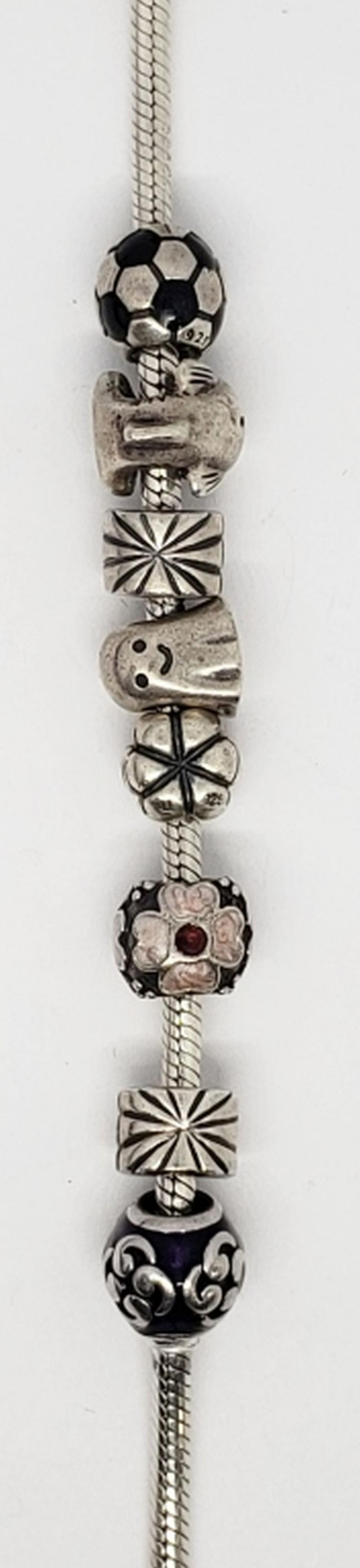 PANDORA STERLING BRACELET WITH (7)ALE MARKED: PANDORA CHARMS-FISH-DOLPHIN-GHOST-PUMPKIN-SOCCERBALL- TOTAL TOTAL 28.1 DWT
