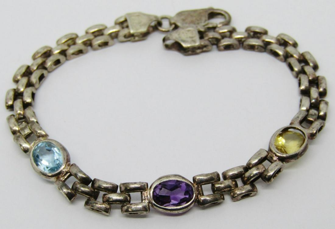 7 INCH WOVEN STYLE STERLING BRACELET WITH: MULTI COLORED STONE ACCENTS-TOTAL 10.5 DWT