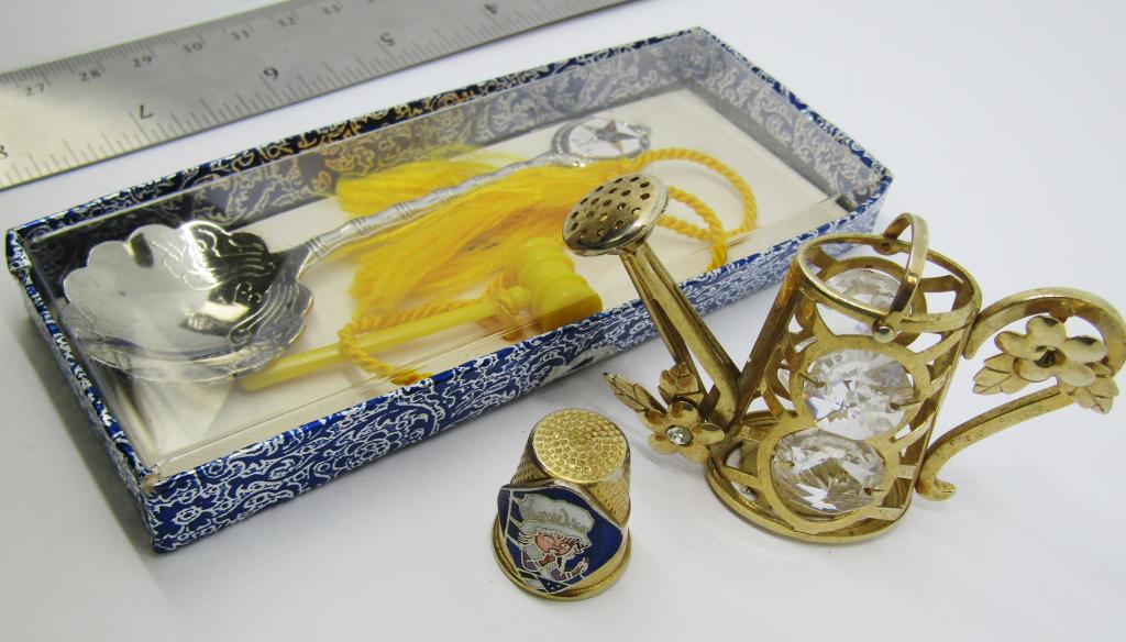 VINTAGE GARDEN WATERING CAN TRINKET & MORE: VINTAGE GOLD TONED GARDEN WATERING CAN TRINKET W/ FLOWERS AND INLAID RHINESTONE(1 STONE MISSIING) 1-GOLD TONED THIMBLE W/ ENAMAL BETSY ROSS STITCHING FLAG 1-SILVER TONED MASONIC SPOON W/ YELLOW TASSLE