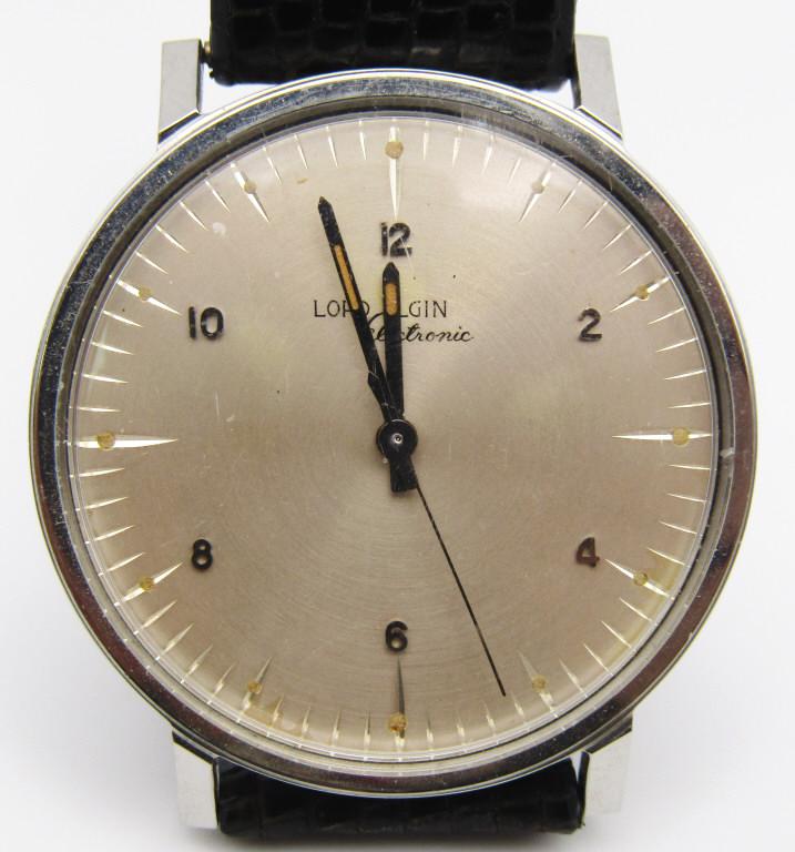 LORD ELGIN ELECTRONIC 725 WRIST WATCH!: STAINLESS STEEL, BRAND NEW! (TAB IS STILL CONNECTED TO THE CROWN);