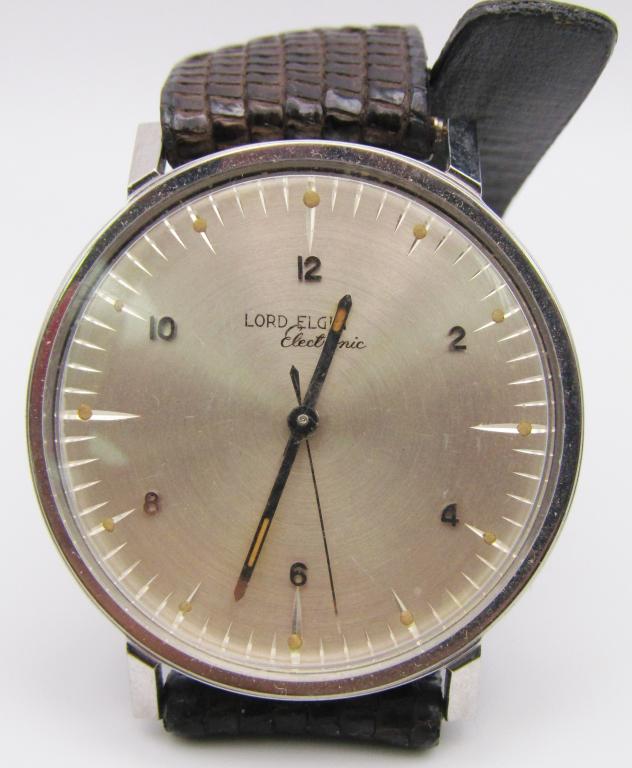 LORD ELGIN ELECTRONIC 725 WRIST WATCH!: STAINLESS STEEL, BRAND NEW! (TAB IS STILL CONNECTED TO THE CROWN);