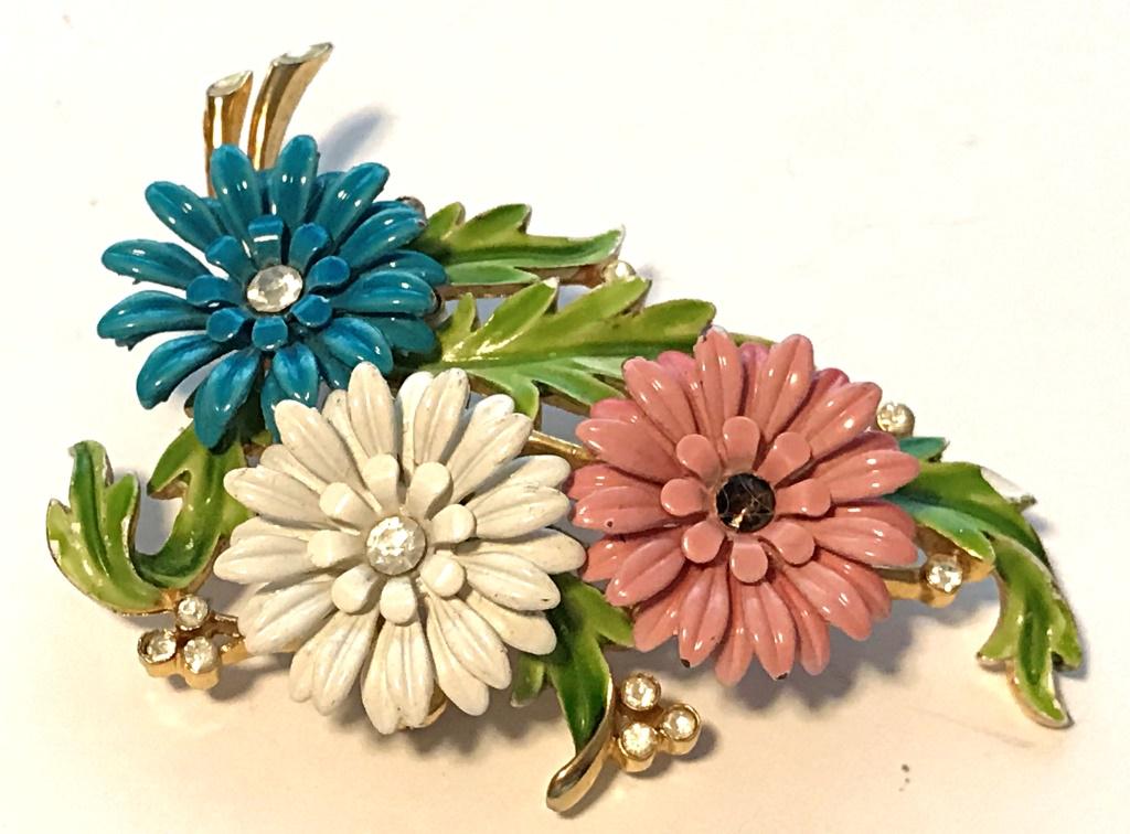 TRIFARI BROOCH W/ FLOWERS: MISSING ONE RHINESTONE, SEE PHOTO, ENAMEL BLUE PINK AND WHITE FLOWERS WITH GREEN LEAF ACCENTS