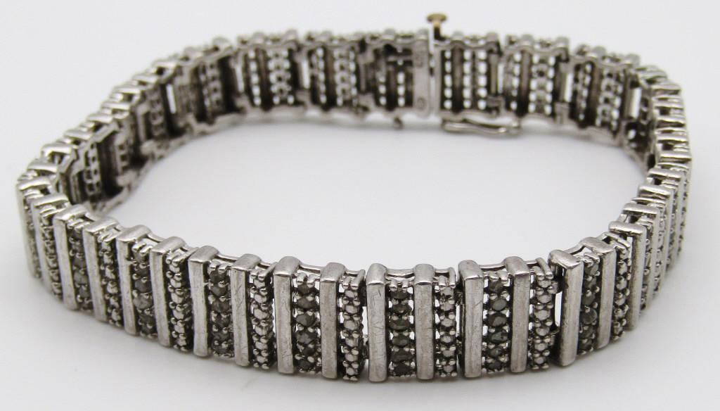 7.5 INCH THINK STERLING TENNIS BRACELET WITH: POSSIBLE CZ STONES-TOTAL 13.1 DWT