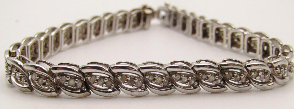 7 INCH STERLING TENNIS BRACELET WITH: CLEAR STONES! TOTAL 8.8 DWT