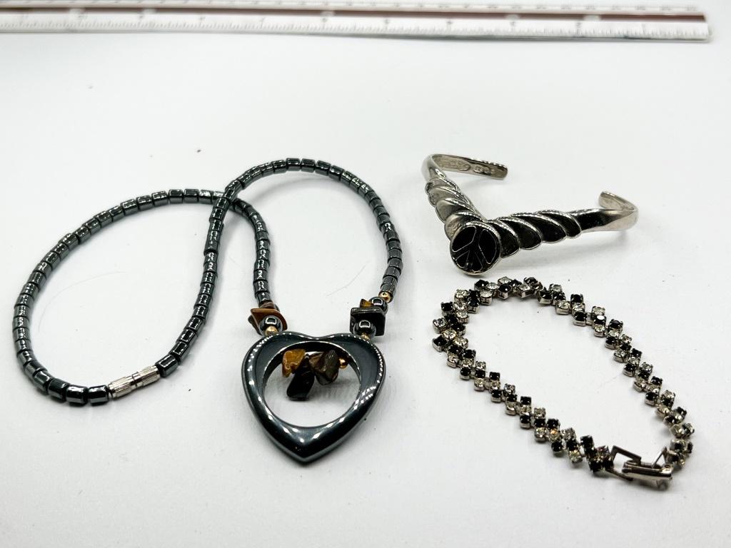 2 BRACELETS, ONE NECKLACE IN BLACKS: 2 BRACELETS, ONE NECKLACE IN BLACKS, ONE BLACK AND WHITE RHINESTONES