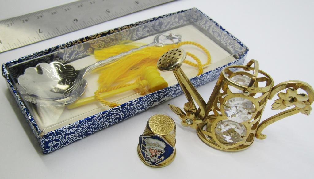 VINTAGE GARDEN WATERING CAN TRINKET & MORE: VINTAGE GOLD TONED GARDEN WATERING CAN TRINKET W/ FLOWERS AND INLAID RHINESTONE(1 STONE MISSIING) 1-GOLD TONED THIMBLE W/ ENAMAL BETSY ROSS STITCHING FLAG 1-SILVER TONED MASONIC SPOON W/ YELLOW TASSLE