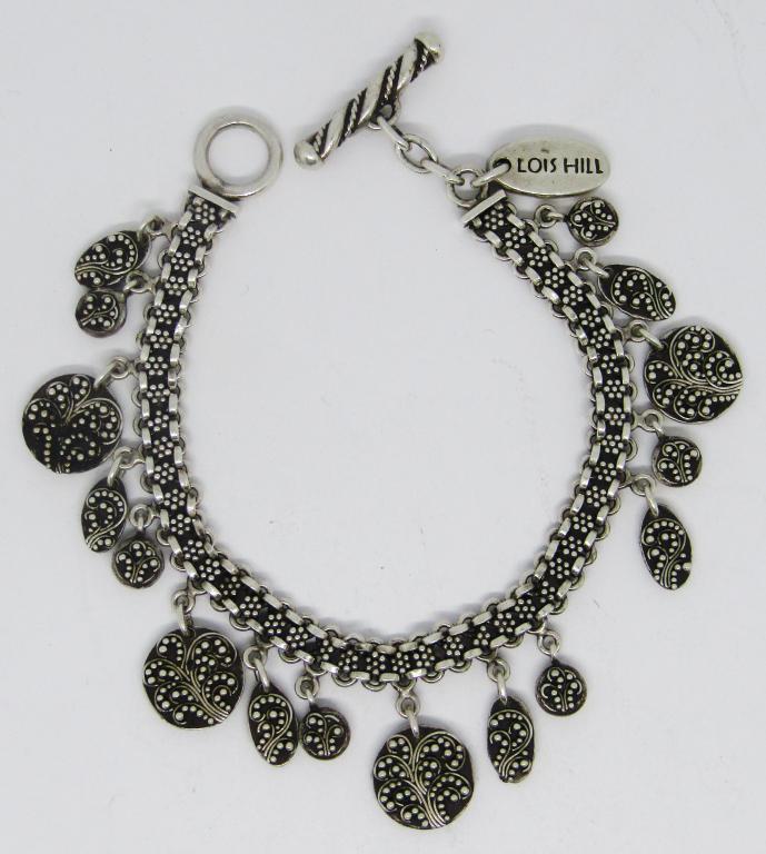 VTG INDONESIA STERLING BRACELET WITH DANGLY: CHARMS-MEASURES 7 INCHES-TOTAL 19 DWT