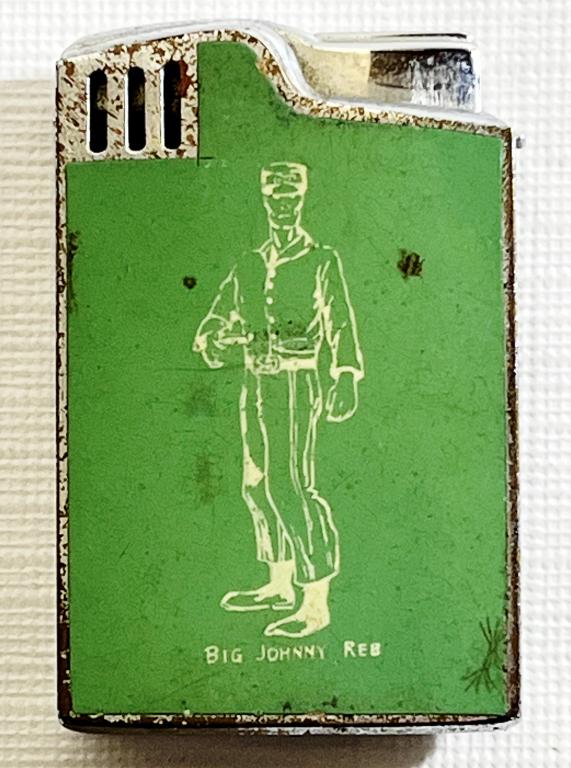 Vintage Hadson Blue Bird Musical Lighter: Big Johnny Reb with Standing man on Front, WDAK in a heart and Columbus GA on back, Has music box winder DOES NOT PLAY MUSIC, Marked HADSON BLUE BIRD PAT NO. 141469 on bottom.