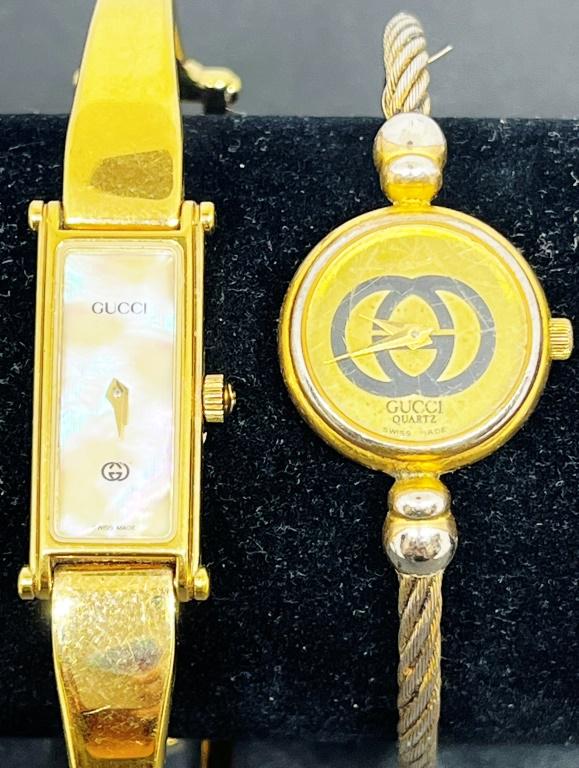 2 Gold Tone GUCCI Ladies Watches: UNTESTED. GUCCI. Gucci gold tone bangle marked 2047L. Gold Tone Gucci Bracelet Style band, Mother of pearl dial face, marked 1500.