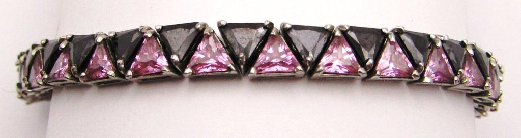 8.5 INCH STERLING TENNIS BRACELET WITH: TRIANGULAR BLACK AND PINK STONES-TOTAL 16 DWT