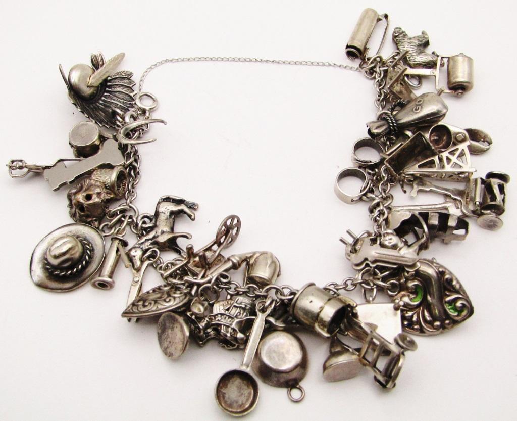 VINTAGE STERLING CHARM BRACELET LOADED WITH (1 of 5)