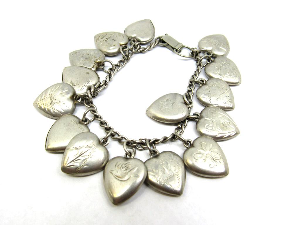 VINTAGE STERLINIG CHARM BRACELET LOADED WITH (1 of 2)