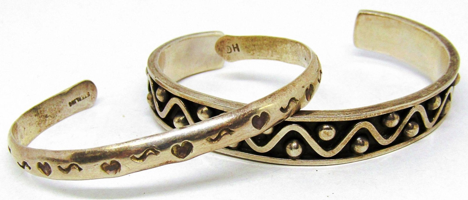 (2) SOUTHWEST STERLING CUFF BRACELETS: SMALL HEART STAMPED "HC" 7" with GAP; LARGER CUFF STAMPED TP-122 925 MEXICO 7 3/4" with GAP - 26 dwt