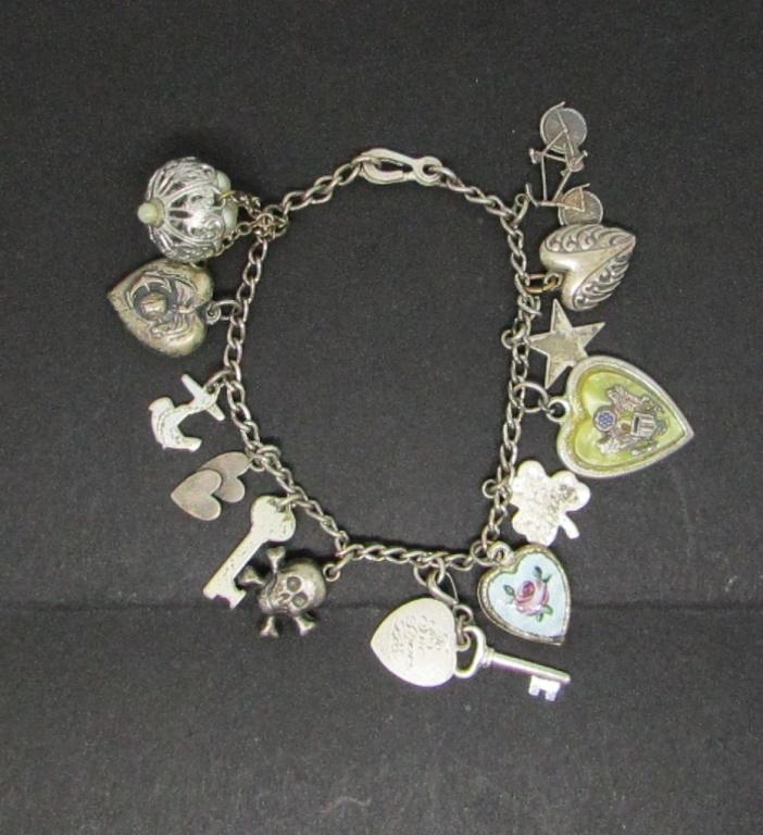 VINTAGE LOADED STERLING CHARM BRACELET: SKULLS-(2)MILITARY-FAUX PEARLS-ENAMEL TOTAL 75.1 DWT