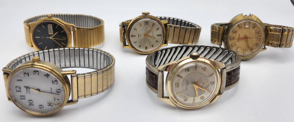 5-VTG MEN'S GOLD TONED WRISTWATCHES WITH: STRETCHY BANDS: ELGIN AUTOMATIC CALENDAR (RUNNING)-BULOVA 17 JEWELS-JULES JERGUSON DAY DATE-TIMEX INDIGLO-LUZERNE CALENDAR-ALL WATCHES UNTESTED