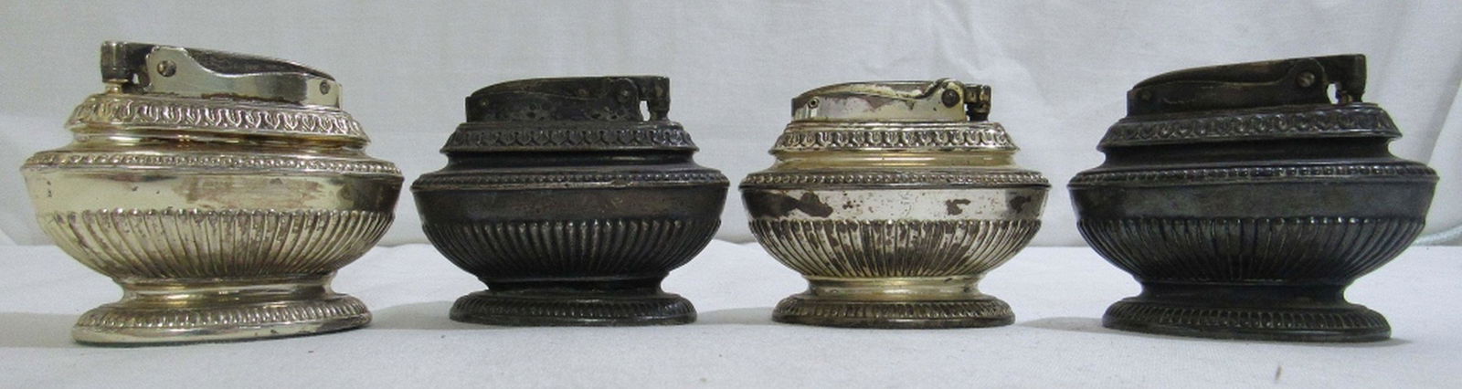 (4) Ronson "Queen Anne" Table Lighters: (4) Silver plated Queen Anne style table lighters. Average condition, toning on all, and all untested.