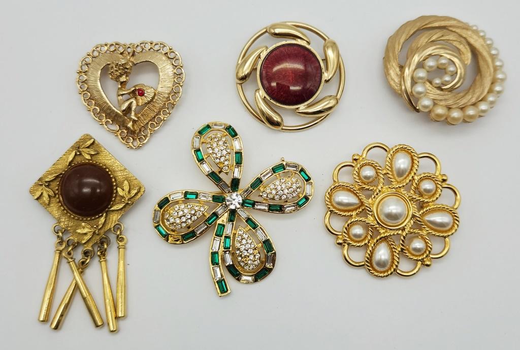 6-VINTAGE GOLD TONED BROOCHES: TRIFARI: WITH FAUX PEARLS-NAPIER WITH CREME LUCITE-NO LEADS SHAMROCK WITH RHINESTONES (1)MISSING-BEAUTRIX HEART ANGEL & MORE!