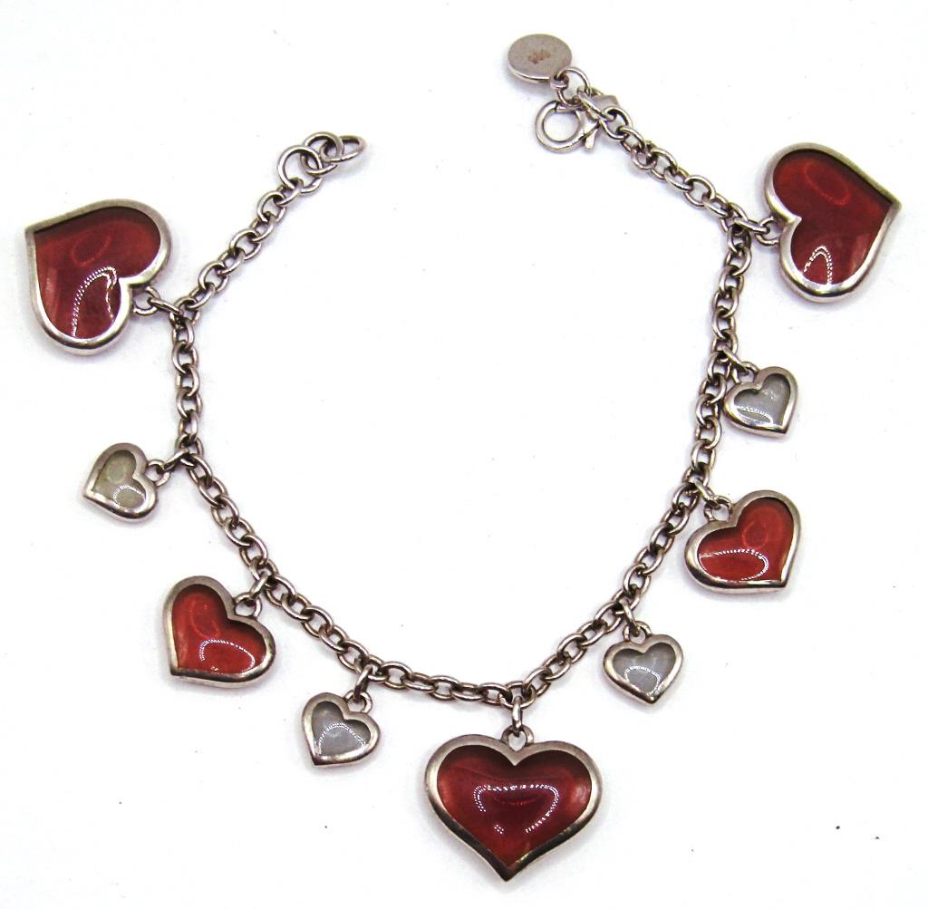 Sterling Heart Bracelet: Cute 7.5 inch bracelet with pink and white alternating heart charms and a working clasp. (10 dwt)