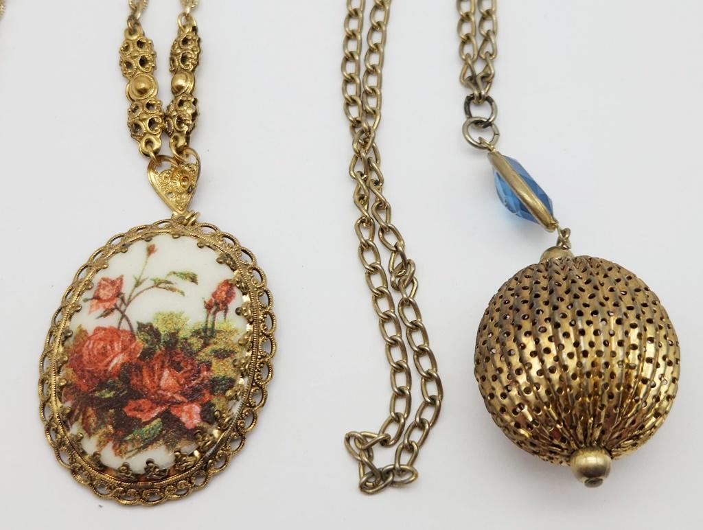 2-VINTAGE GOLD TONED NECKLACES: (1)WITH: ROSE SCENE PENDANT WITH FILIGREE BACK & (1)WITH FILIGREE 3-D DOME PENDANT