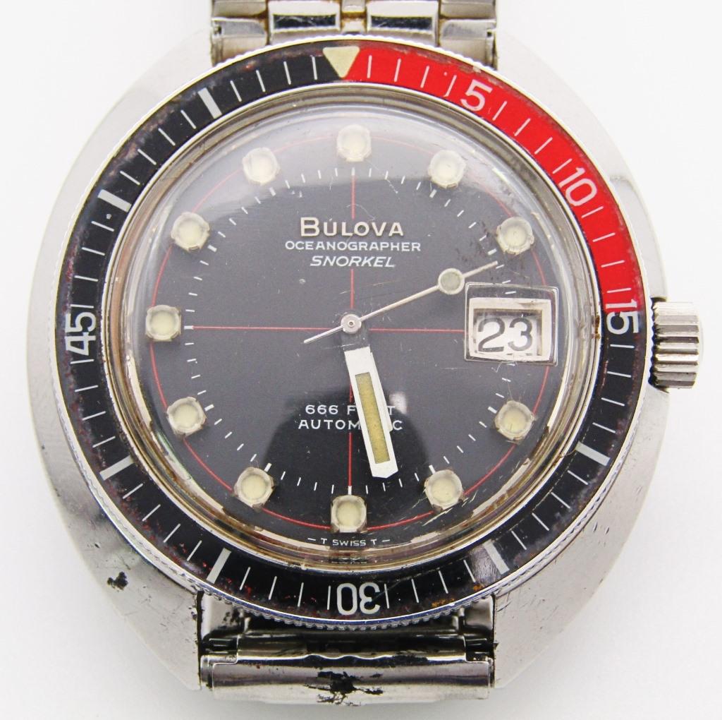 BULOVA OCEANOGRAPHER SNORKEL WATCH: BLACK DIAL with LUME MARKERS and LUME HANDS are PERFECT. COKE BEZEL ROTATES and IS NEAR PERFECT. SCREWBACK CASE Ref 714, 17 jewel AUTOMATIC MOVEMENT, 11BLACD, SPEIDEL STAINLESS BRACELET, THIS IS A NIC