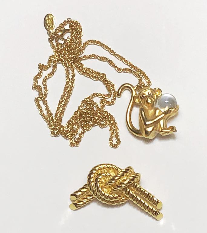 JOAN RIVERS! FORTUNE TELLING MONKEY & BOW BROOCH: BOTH MARKED JOAN RIVERS, MONKEY IS HOLDING CLEAR COLORED BALL