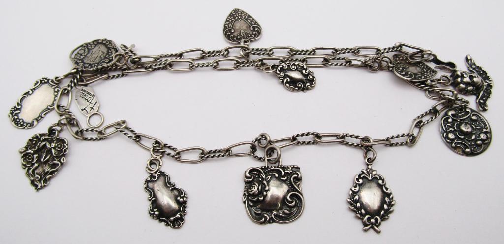 T FOREE HUNSICKER 925 CHERUB LUGGAGE TAG: NECKLACE MEASURES 23 INCHES-TOTAL 34 DWT
