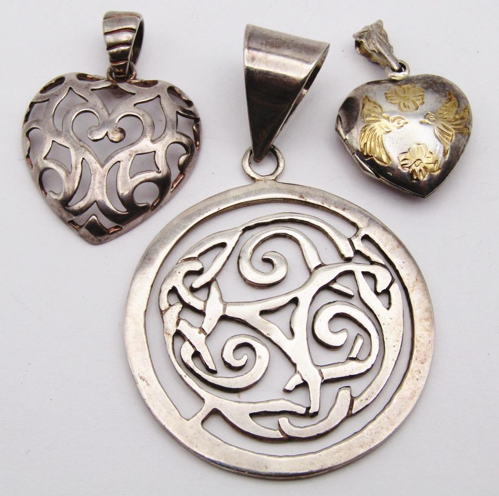 3-STERLING PENDANTS: (1)MILOR ITALY HEART: (1)HEART LOCKET WITH GOLD TONED BIRD ACCENTS (1)CIRCULAR WITH CUT OUT DESIGN-TOTAL 19 DWT