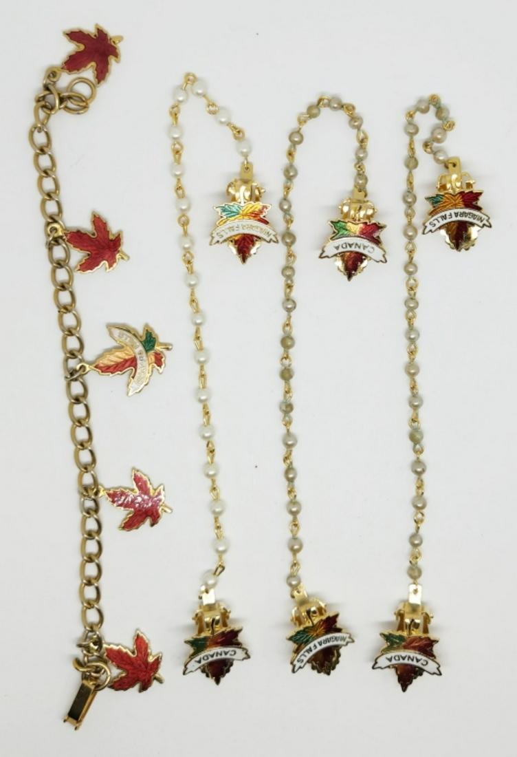 VINTAGE GOLD TONED CANADA/NIAGRA FALLS: ENAMEL LEAF JEWELRY LOT: (3)COLLAR PINS & (1)CHARM BRACELET