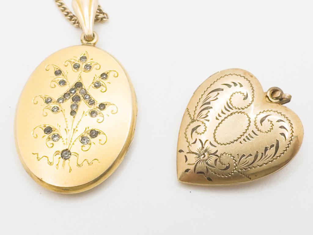 2 ENGRAVED LOCKETS: 2 ENGRAVED LOCKETS, ONE WITH SMALL STONES 128