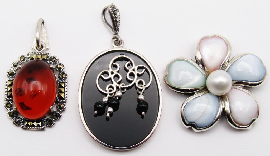 3-STERLING FASHION PENDANTSl (2)MARCASITE: (1)FLOWER WITH LUCITE AND PEARL CENTER-TOTAL 13 DWT