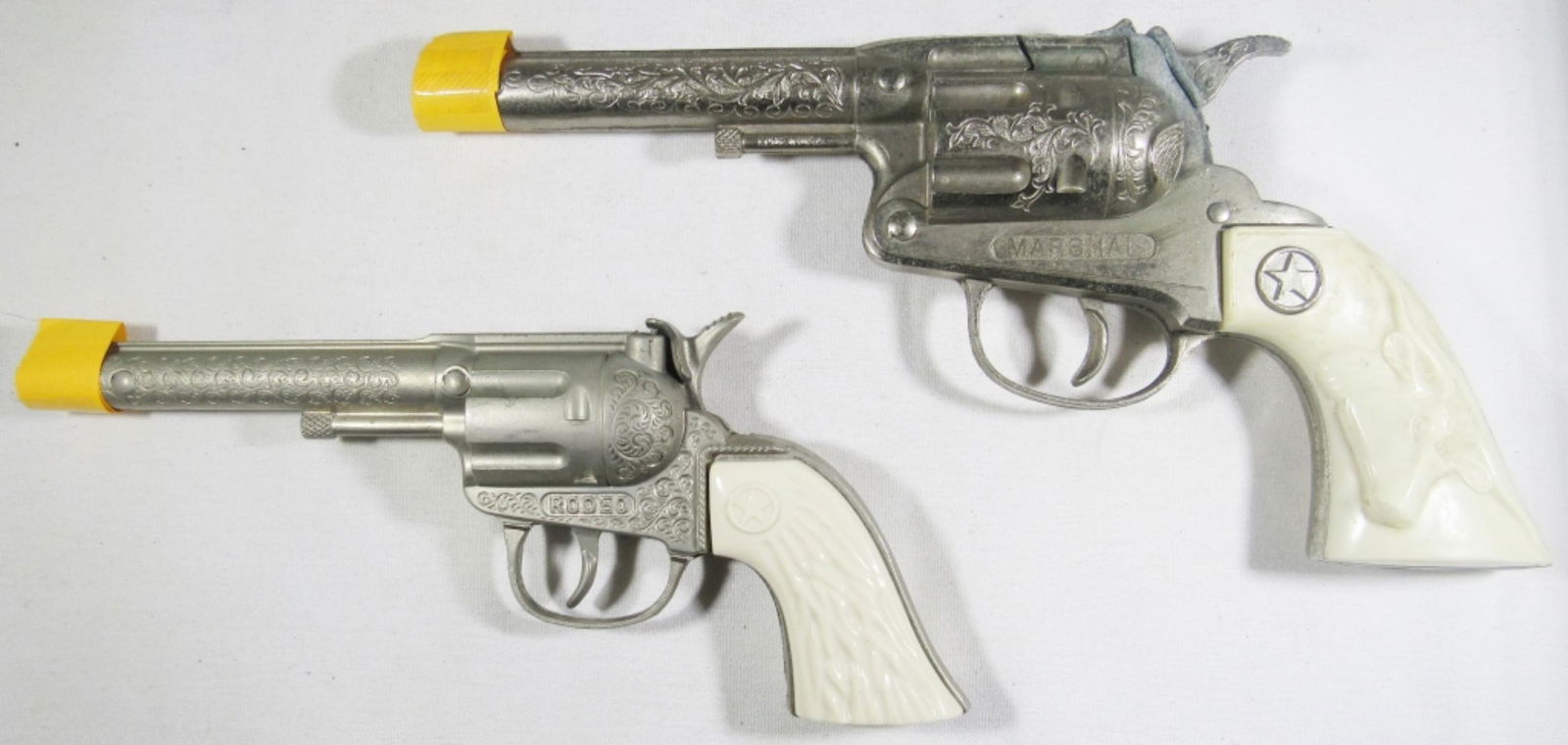 (2) HUBLEY VINTAGE CAP GUNS - MARSHALL: WORKS but TRIGGER DOESN'T SNAP BACK & RODEO WORKS NICE CONDITION