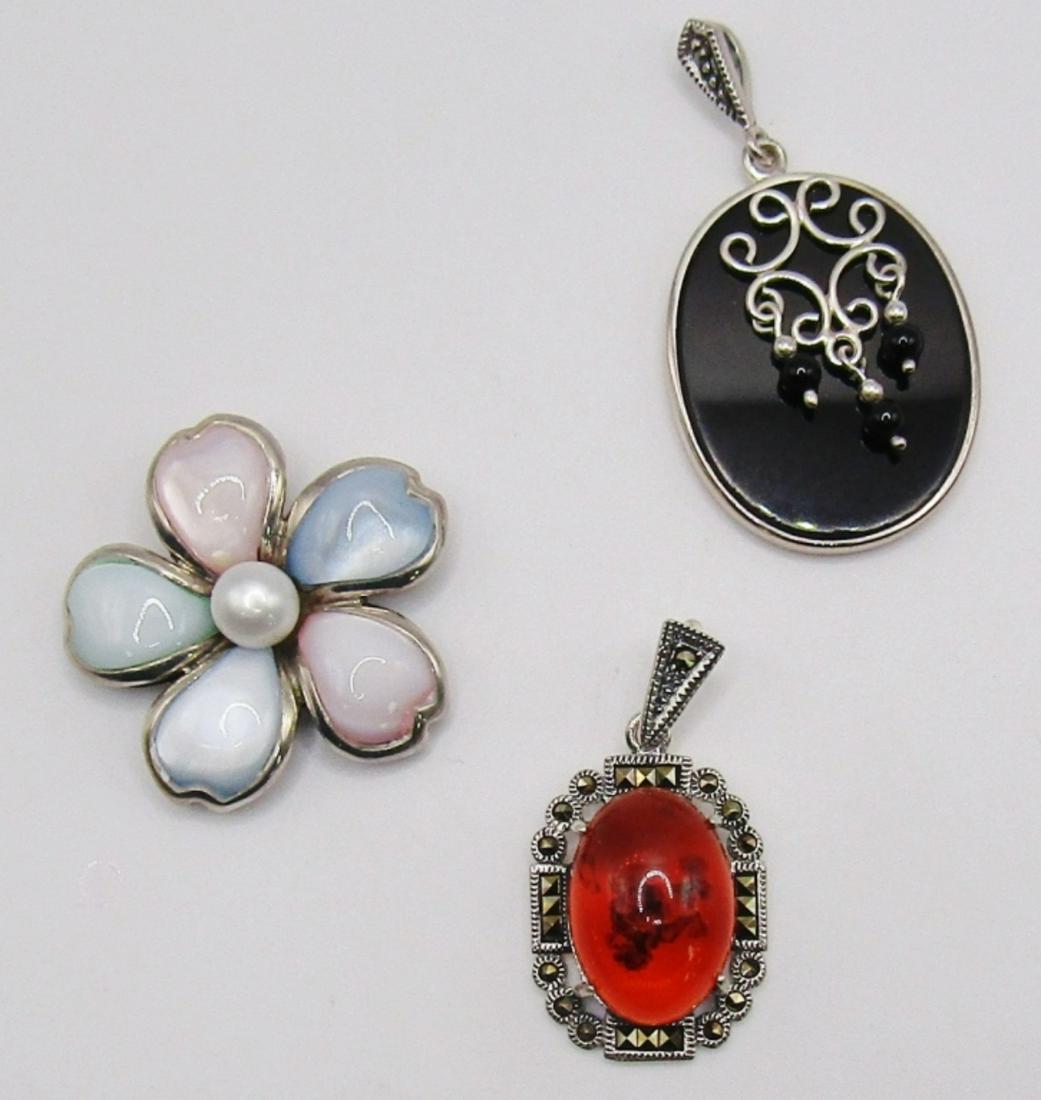 3-STERLING FASHION PENDANTSl (2)MARCASITE: (1)FLOWER WITH LUCITE AND PEARL CENTER-TOTAL 13 DWT