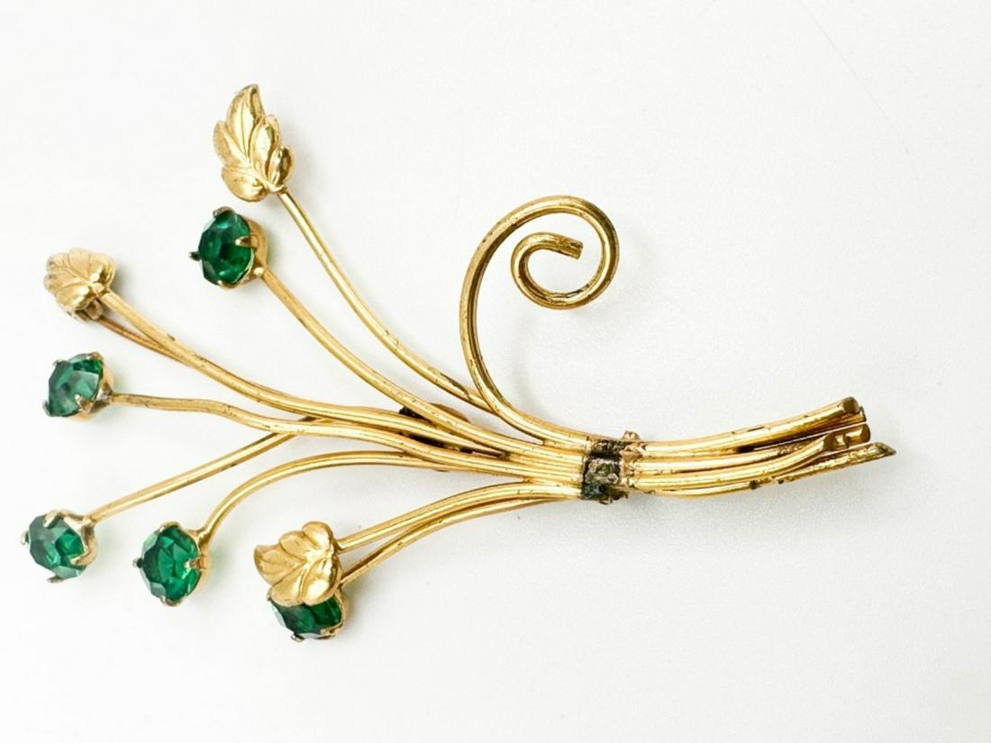 FLORAL SPRAY BROOCH: FLORAL SPRAY BROOCH WITH GREEN STONES, MARKED STERLING AND CORO MARKING